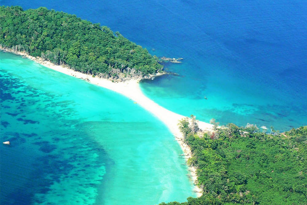 Aerial view of a white sand bar between two Andaman islands